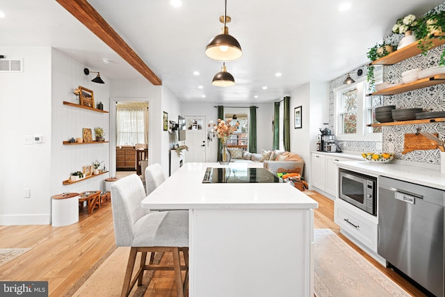 307 Kendall Blvd, Oaklyn, NJ 08107 - kitchen featuring open shelves, visible vents, stainless steel appliances, light wood finished floors, and backsplash