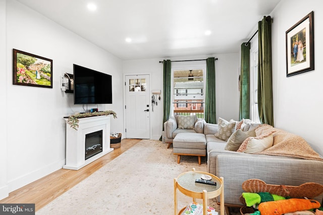 307 Kendall Blvd, Oaklyn, NJ 08107 - living room featuring baseboards, recessed lighting, a glass covered fireplace, and light wood-style floors