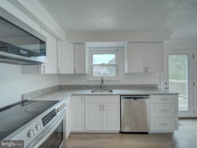 1566 Lodge Pole Ct, Annapolis, MD 21409 - kitchen with a sink, stainless steel appliances, a textured ceiling, and white cabinetry