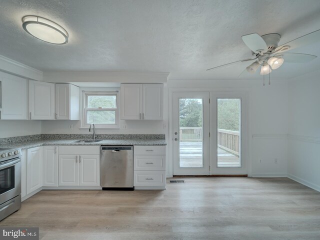 1566 Lodge Pole Ct, Annapolis, MD 21409 - kitchen featuring light wood-style floors, a sink, white cabinetry, and appliances with stainless steel finishes
