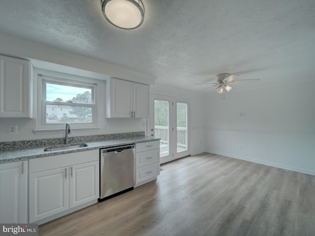 1566 Lodge Pole Ct, Annapolis, MD 21409 - kitchen featuring a sink, light wood finished floors, dishwasher, a textured ceiling, and white cabinetry