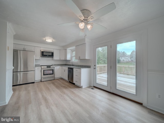1566 Lodge Pole Ct, Annapolis, MD 21409 - kitchen featuring a ceiling fan, light wood-type flooring, a sink, white cabinets, and stainless steel appliances