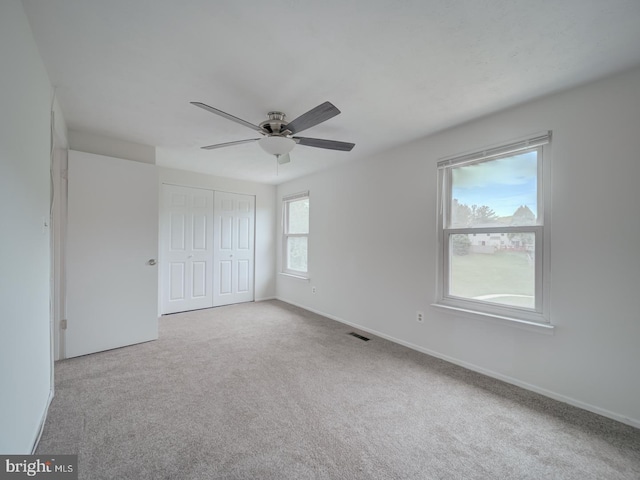 1566 Lodge Pole Ct, Annapolis, MD 21409 - unfurnished bedroom featuring a ceiling fan, visible vents, baseboards, a closet, and carpet