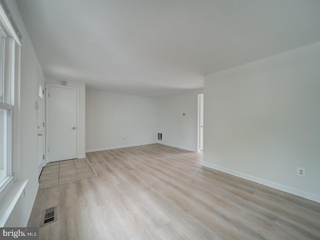1566 Lodge Pole Ct, Annapolis, MD 21409 - unfurnished living room featuring baseboards, light wood-style flooring, and visible vents