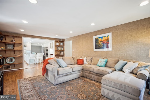 living room featuring visible vents, recessed lighting, wood finished floors, and wallpapered walls