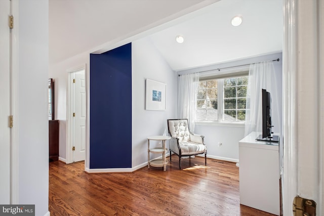 sitting room featuring wood finished floors, baseboards, lofted ceiling, and recessed lighting