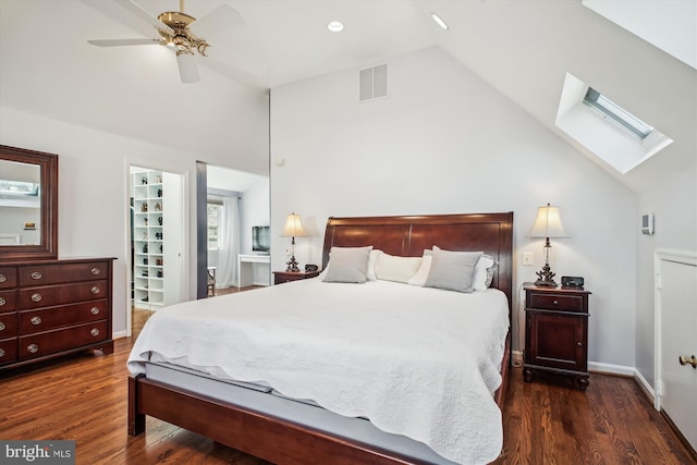 bedroom featuring visible vents, a skylight, wood finished floors, and baseboards
