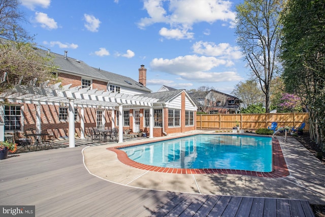 view of pool featuring a patio area, fence, a fenced in pool, and a pergola