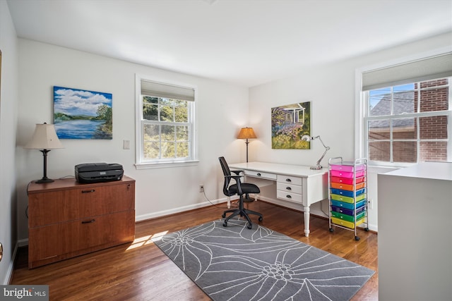 home office with wood finished floors and baseboards