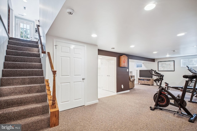 workout area featuring recessed lighting, baseboards, and carpet floors