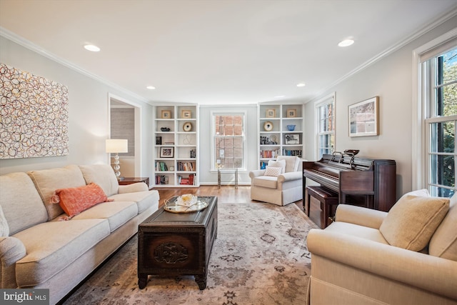 living room featuring recessed lighting, built in features, crown molding, and wood finished floors