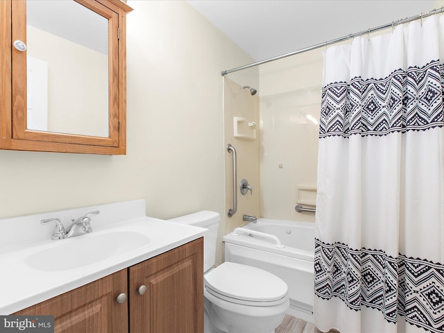 bathroom featuring toilet, shower / bath combo, and vanity