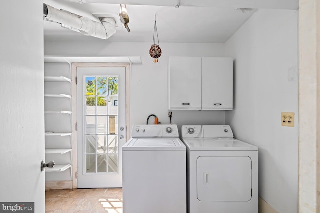 laundry area with cabinet space and washing machine and clothes dryer