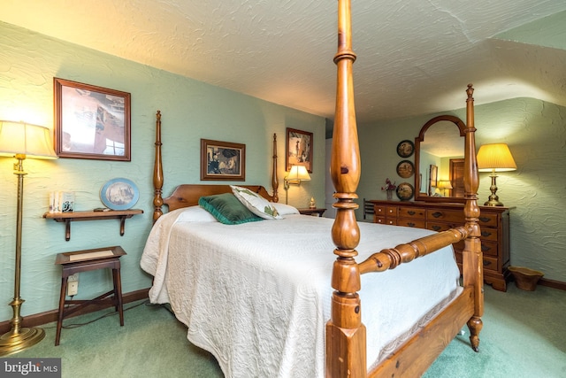 carpeted bedroom with baseboards, a textured ceiling, and a textured wall