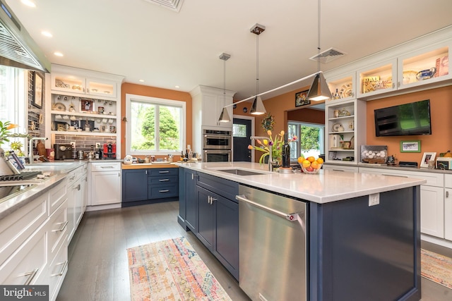 kitchen with open shelves, appliances with stainless steel finishes, white cabinetry, and recessed lighting