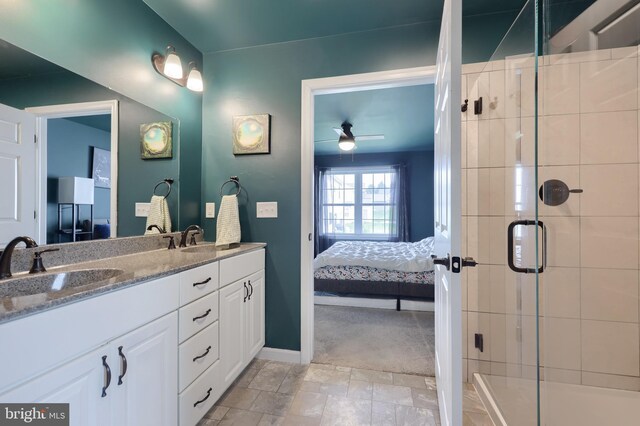 full bathroom featuring ensuite bath, a sink, a stall shower, and double vanity