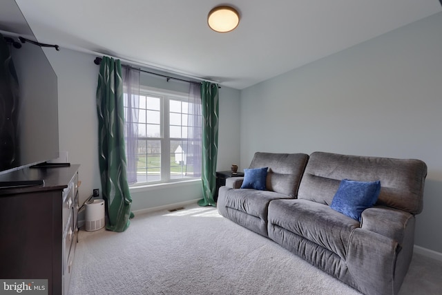 living room featuring carpet floors, baseboards, and visible vents