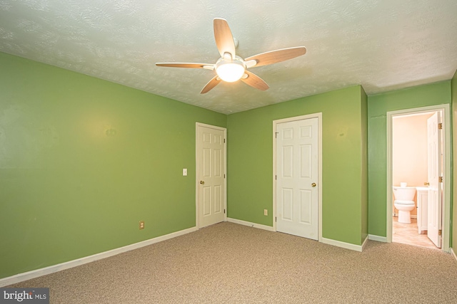 302 Parkside Rd, Linden, VA 22642 - unfurnished bedroom with baseboards, carpet floors, a textured ceiling, connected bathroom, and ceiling fan