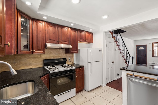 2225 S Hicks St, Philadelphia, PA 19145 - kitchen with a sink, freestanding refrigerator, dishwasher, under cabinet range hood, and gas range