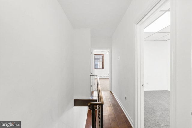 2225 S Hicks St, Philadelphia, PA 19145 - hallway with a baseboard radiator, baseboards, and dark wood-style floors