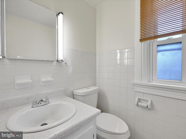 1402 Elm St, Lebanon, PA 17042 - bathroom featuring tile walls, toilet, vanity, and ornamental molding