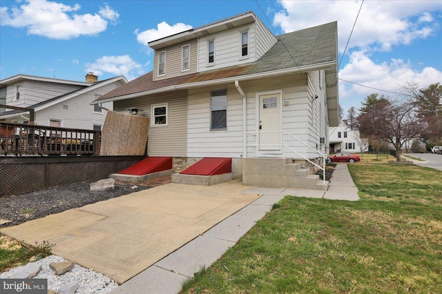 1402 Elm St, Lebanon, PA 17042 - rear view of property with a wooden deck, a yard, and a shingled roof