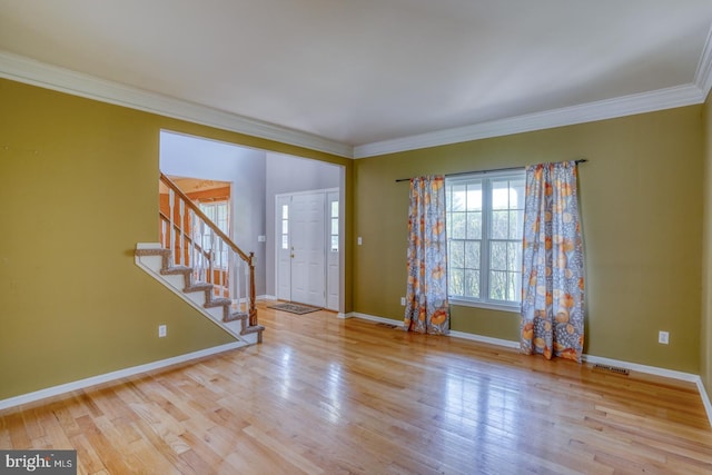 208 Grouse Trl, Camden Wyoming, DE 19934 - entrance foyer featuring baseboards, ornamental molding, stairs, and visible vents