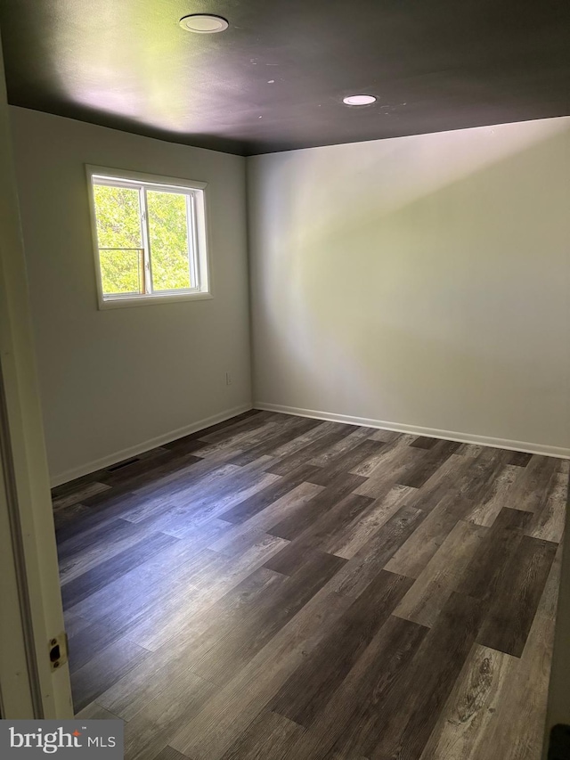 354 Kemper Dr, Newark, DE 19702 - spare room with dark wood-type flooring and baseboards