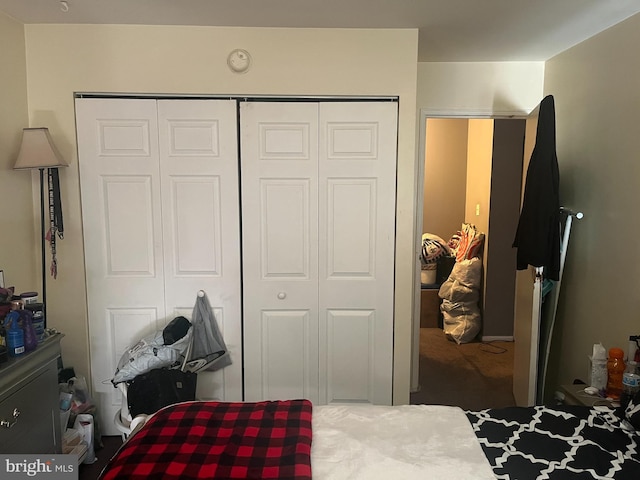 carpeted bedroom featuring a closet