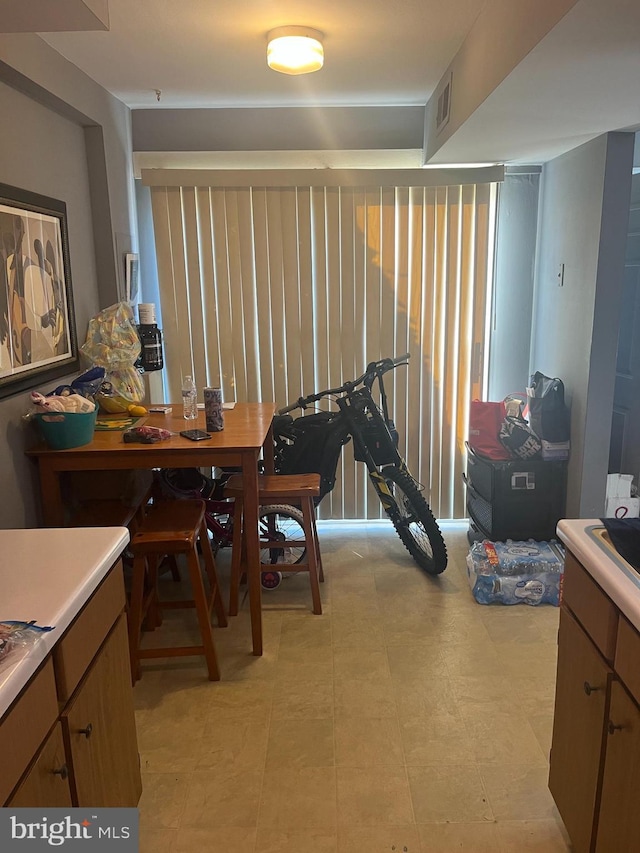 dining room featuring visible vents and light floors