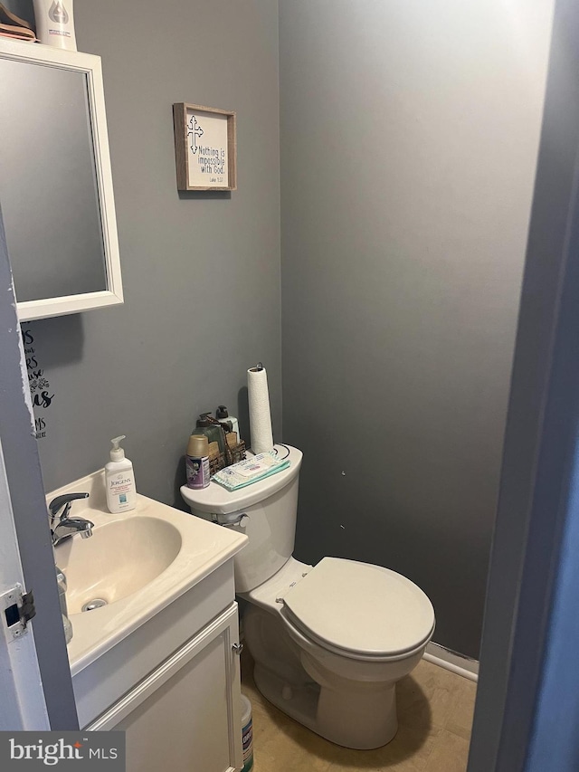 half bath with toilet and vanity