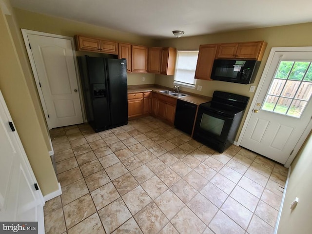 kitchen with a sink and black appliances