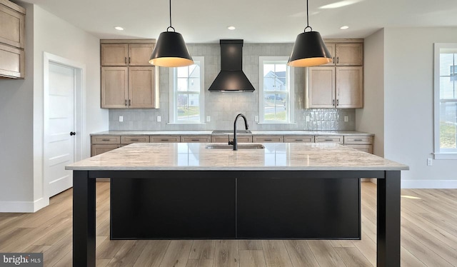 1999 N Fall Harvest Dr, Mechanicsburg, PA 17055 - kitchen featuring a sink, decorative backsplash, wall chimney exhaust hood, and light stone counters