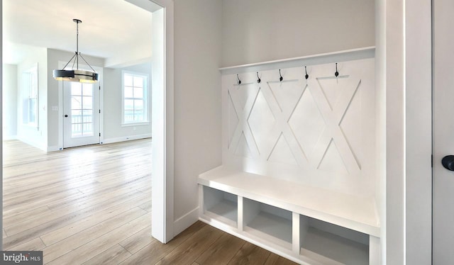 1999 N Fall Harvest Dr, Mechanicsburg, PA 17055 - mudroom featuring baseboards, a notable chandelier, and wood finished floors