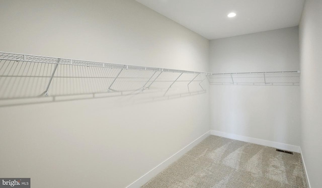 1999 N Fall Harvest Dr, Mechanicsburg, PA 17055 - walk in closet featuring light carpet and visible vents
