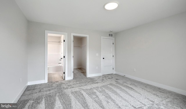 1999 N Fall Harvest Dr, Mechanicsburg, PA 17055 - unfurnished bedroom with baseboards, a closet, a spacious closet, carpet floors, and visible vents