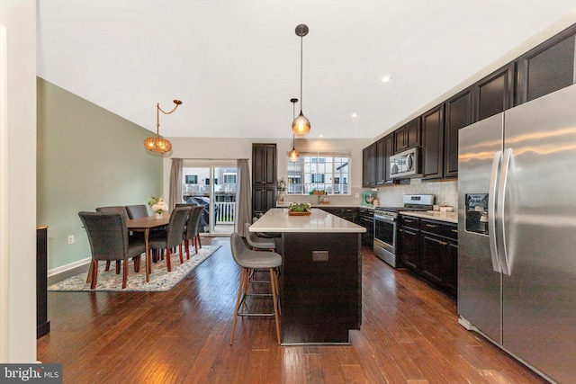 8473 Randell Ridge Rd, Frederick, MD 21704 - kitchen with stainless steel appliances, a kitchen island, light countertops, dark wood-style floors, and recessed lighting