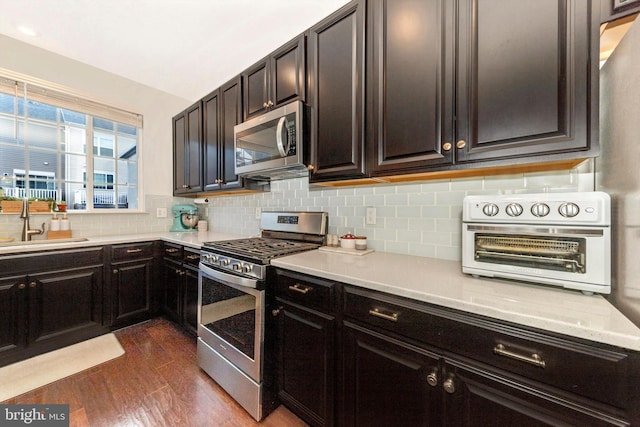 8473 Randell Ridge Rd, Frederick, MD 21704 - kitchen with stainless steel appliances, a sink, dark wood-type flooring, and light countertops