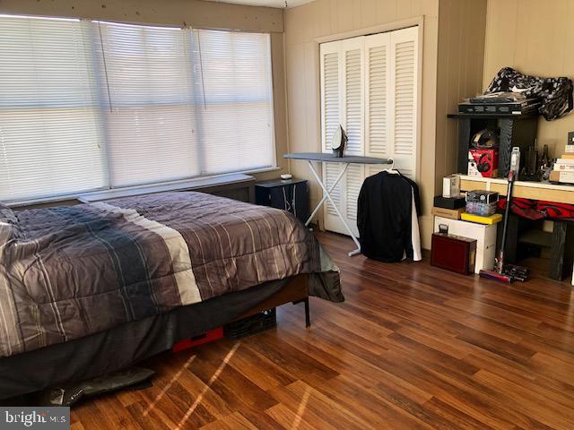 bedroom featuring a closet and wood finished floors