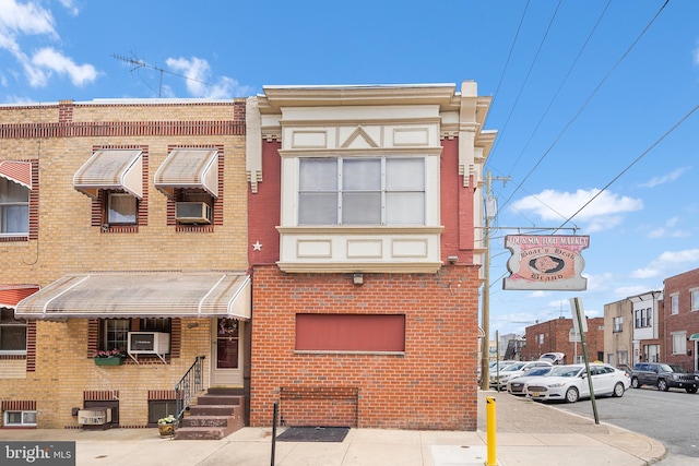 multi unit property with entry steps and brick siding