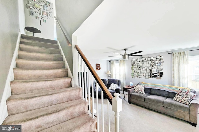 stairway with a ceiling fan