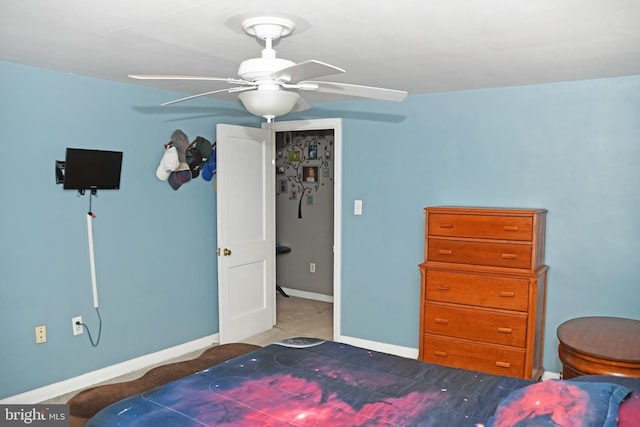bedroom featuring baseboards and a ceiling fan