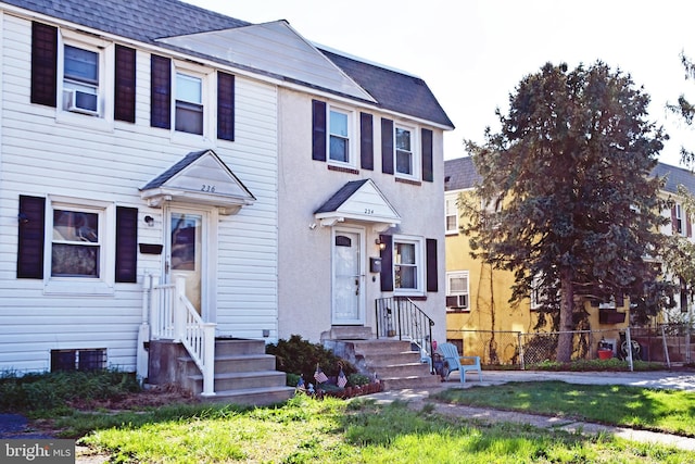 multi unit property with fence and roof with shingles