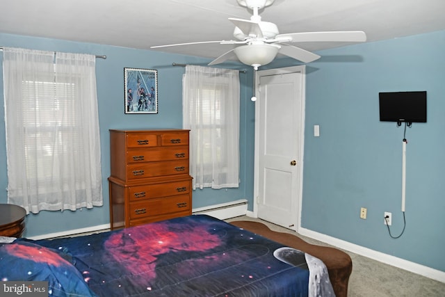 bedroom with carpet, a baseboard heating unit, baseboards, and a ceiling fan