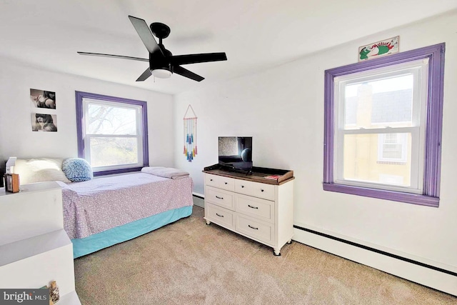 bedroom featuring ceiling fan, light carpet, and baseboard heating