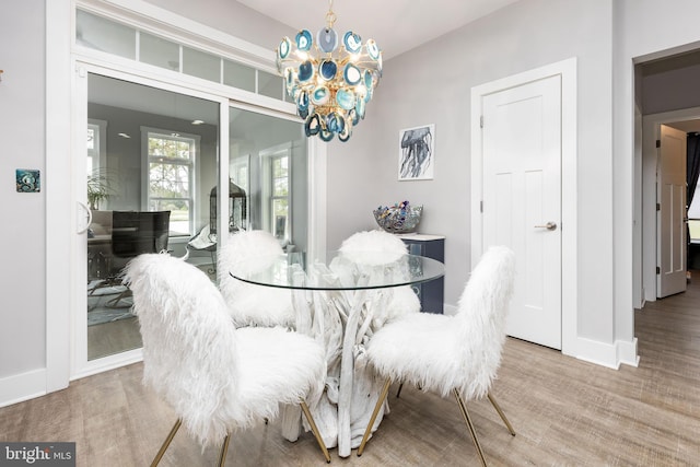 13115 Muirfield Ln, Berlin, MD 21811 - dining space with baseboards and a notable chandelier