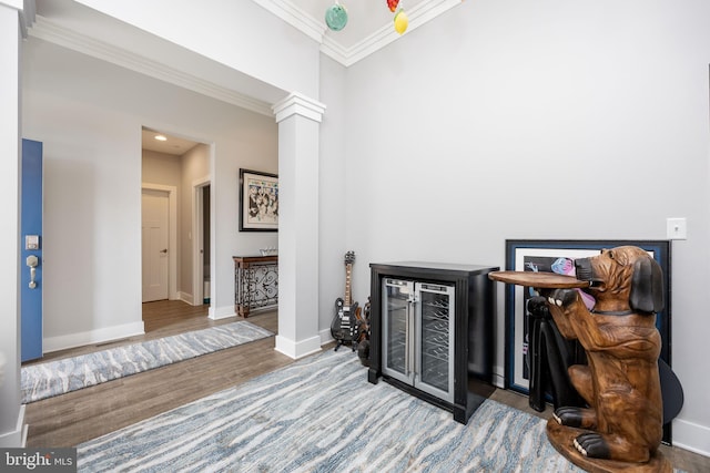13115 Muirfield Ln, Berlin, MD 21811 - living area with crown molding, decorative columns, recessed lighting, wood finished floors, and baseboards