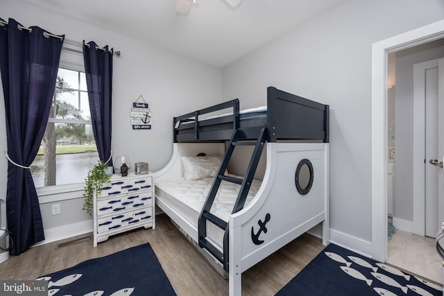 13115 Muirfield Ln, Berlin, MD 21811 - bedroom with wood finished floors, baseboards, a ceiling fan, and visible vents