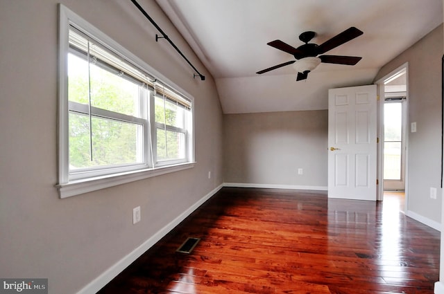 bonus room with a ceiling fan, hardwood / wood-style floors, baseboards, lofted ceiling, and visible vents