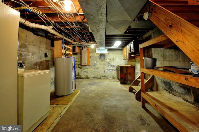 unfinished basement with water heater and washer / clothes dryer